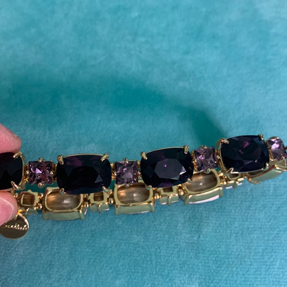 Sodini signed gold tone stretch bracelet with faux purple amethyst 8”